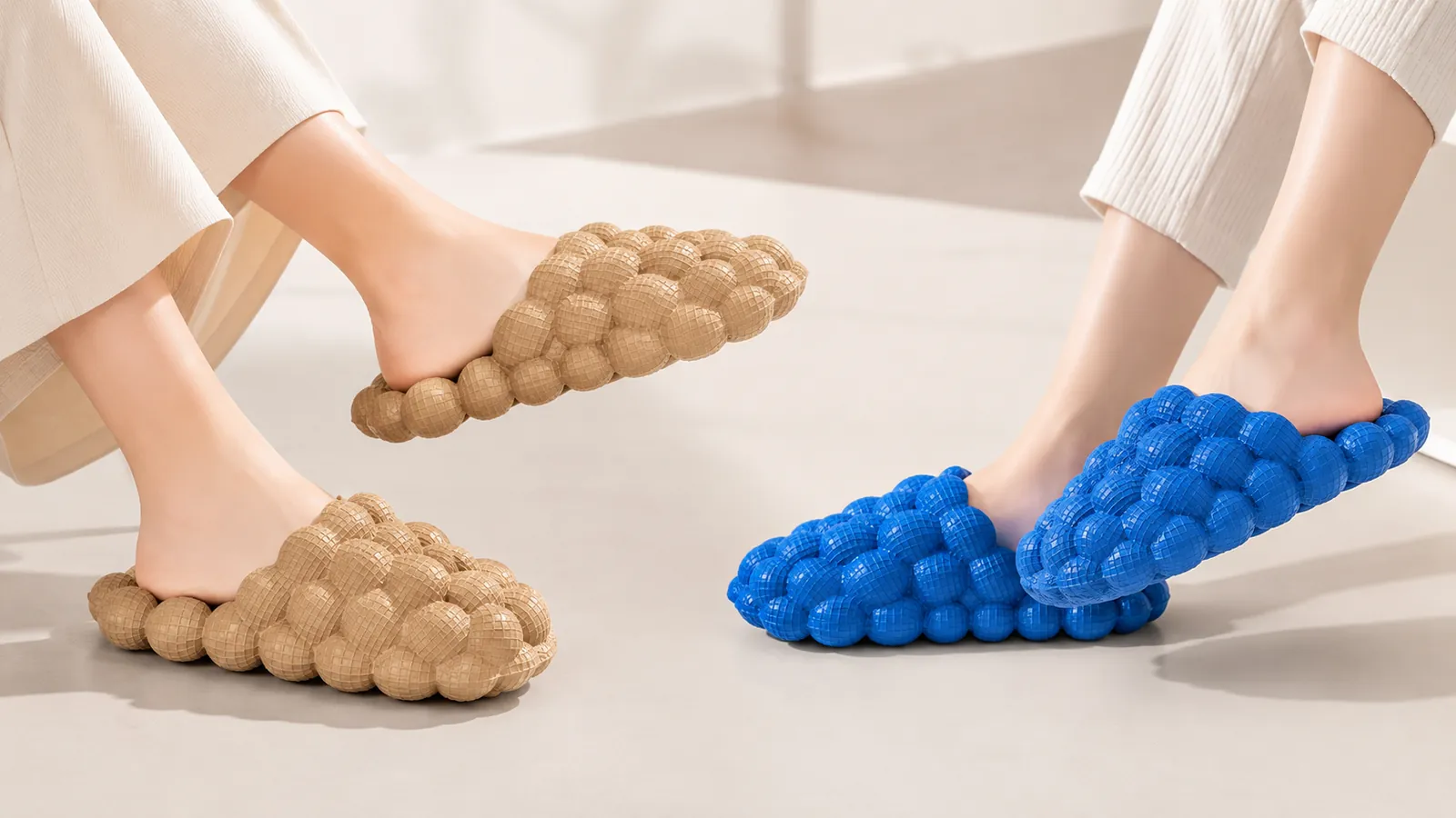 Two people wearing tan and blue bubble slides